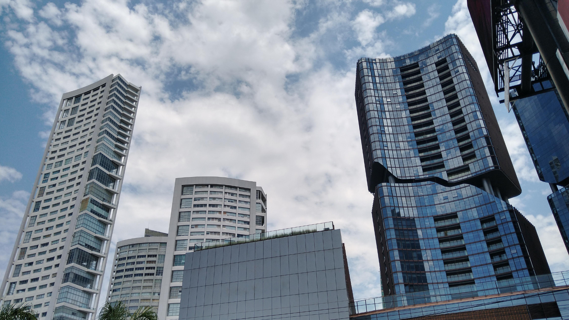 Team collaborating around laptops and whiteboard